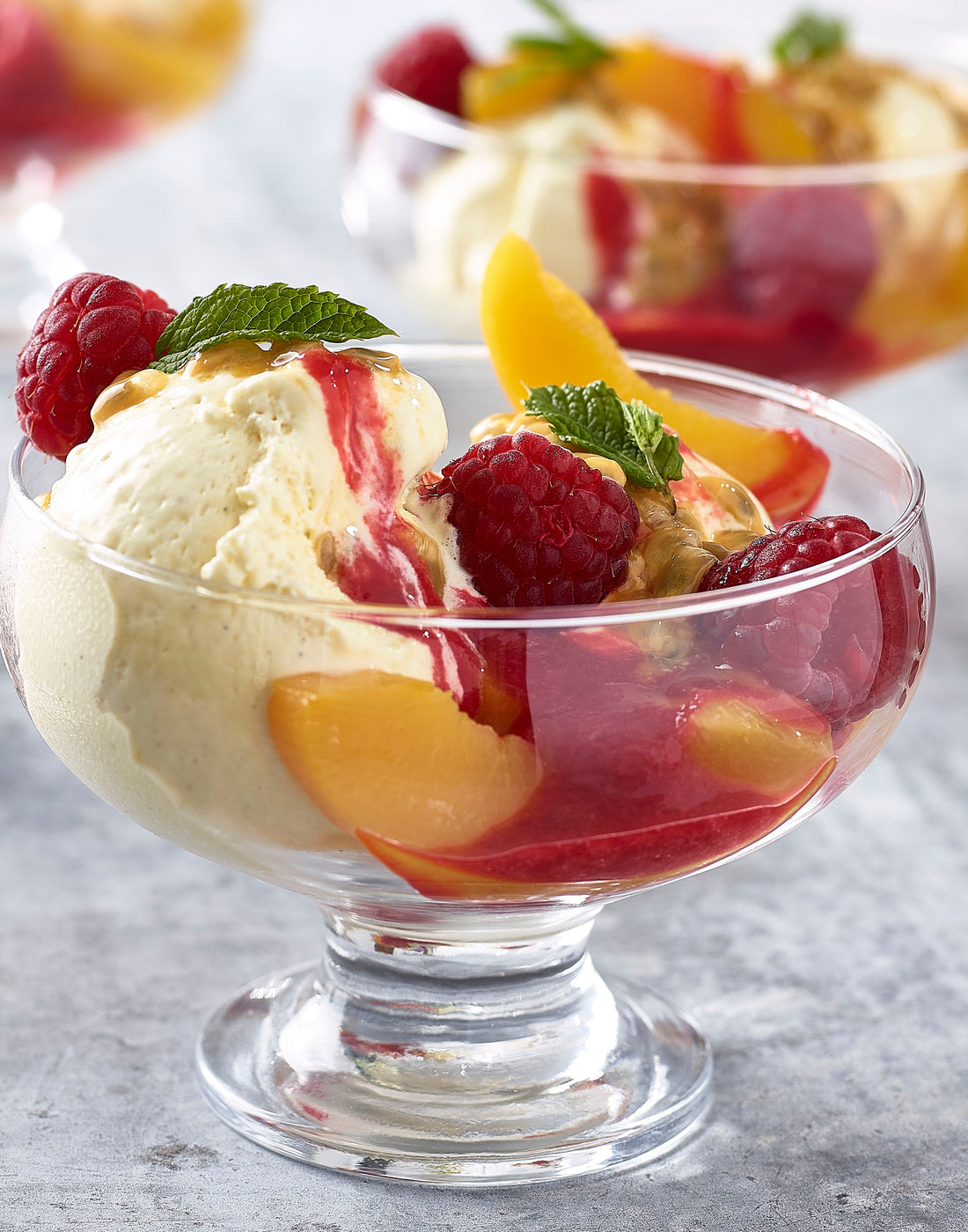 Peach Melba with Raspberry Sauce and Passion fruit