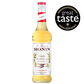 A 700ml bottle of MONIN Vanilla Syrup, labeled "Le Sirop de Monin," features vanilla flowers with the text "Vanilla from Madagascan Vanilla beans" and "Arômes Naturels." The bottle has a red cap and top, and the light golden syrup inside is ideal for various beverage applications.