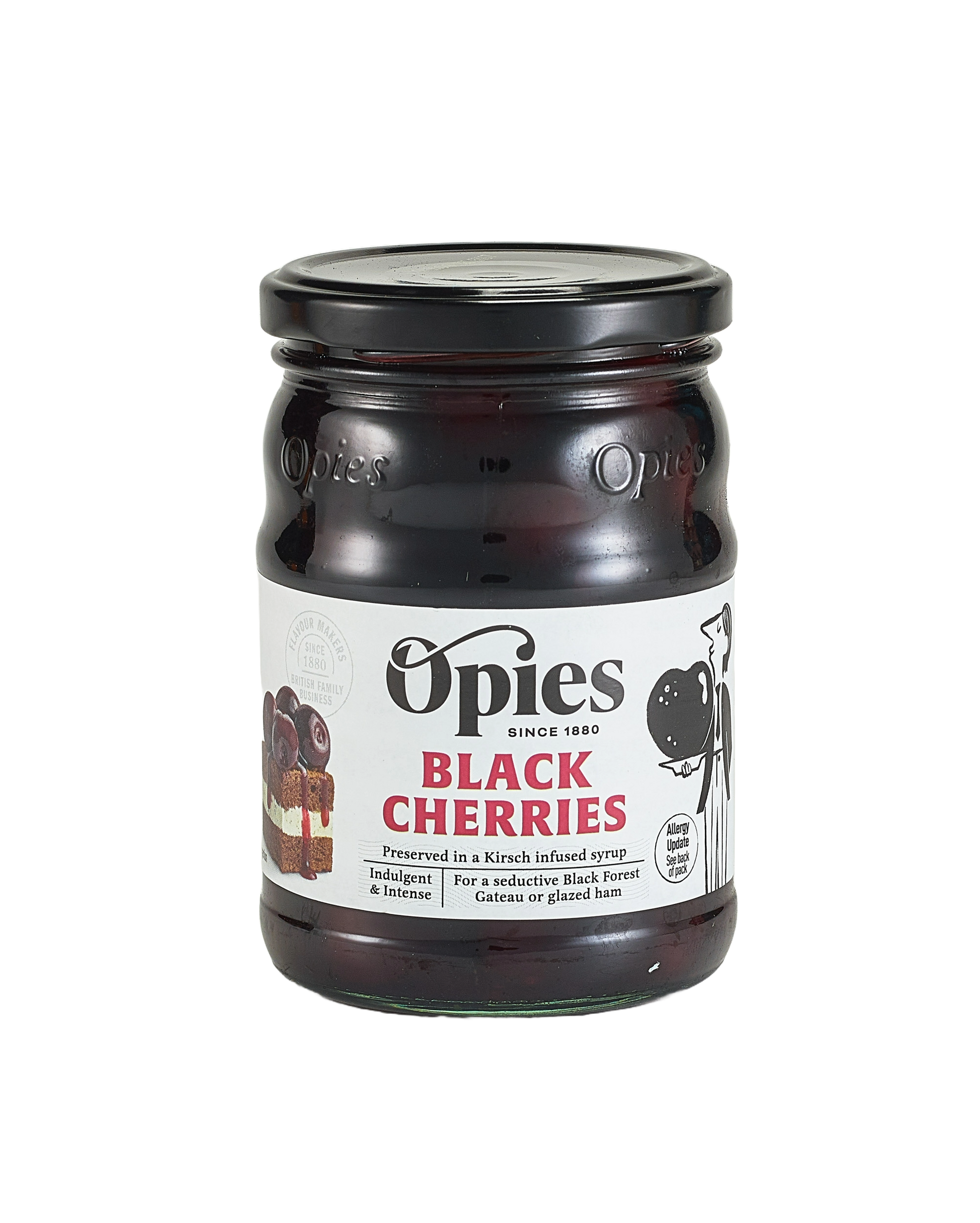 A jar of Opies Black Cherries With Kirsch, a luxurious treat featuring cherries preserved in Kirsch-infused syrup. The label displays enticing images of cherries and desserts, with text emphasizing its perfect use to adorn cakes or elevate indulgent desserts such as Black Forest gateau or glazed ham. The jar boasts a black lid and a transparent glass body, showcasing the rich contents within.