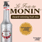 A picture of a "Le Fruit de MONIN Cherry" bottle, an award-winning fruit mix featuring the Bartenders Brand Awards 2023 medal with gold text on a beige background. The bottle comes with a convenient pump dispenser, perfect for creating cocktails and lemonades. Its label showcases ripe cherries accompanied by French text.
