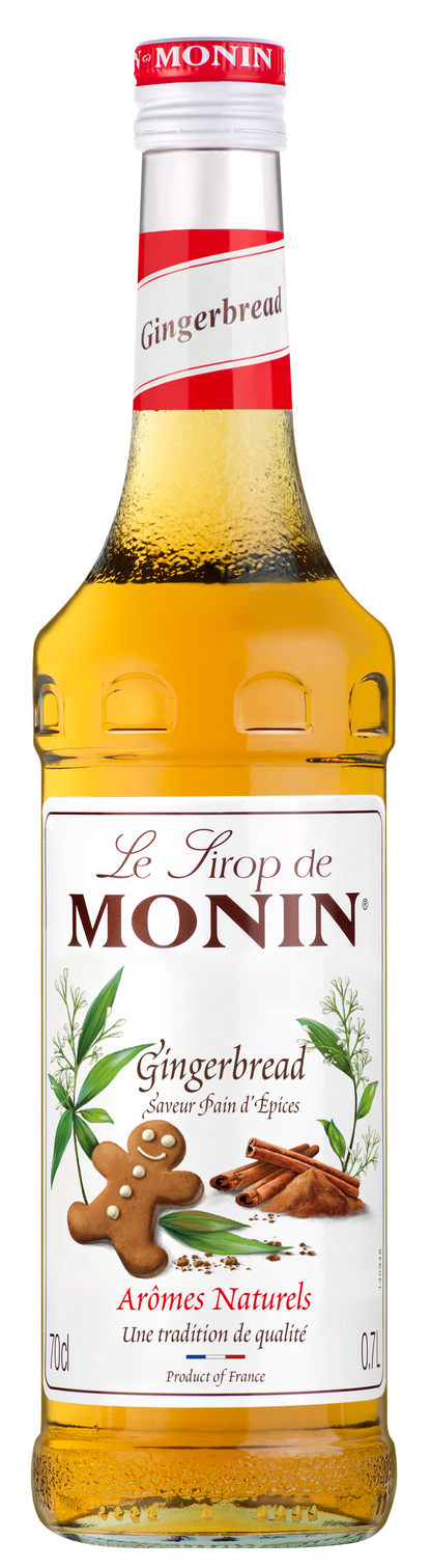 A 70cl bottle of MONIN Gingerbread Syrup, ideal for infusing a festive flavor into your coffees. The label displays "Le Sirop de MONIN" at the top, followed by "Gingerbread" and "Arômes Naturels," featuring an image of a gingerbread cookie and spices with golden brown syrup inside.