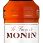 A 700ml bottle of MONIN Salted Caramel Syrup. The label displays caramel squares and a jar of caramel, with text in both French and English, including "Salted Caramel" and "Arômes Naturels." Ideal for enhancing beverages like coffees, the bottle is topped with a red cap featuring the brand name "MONIN.